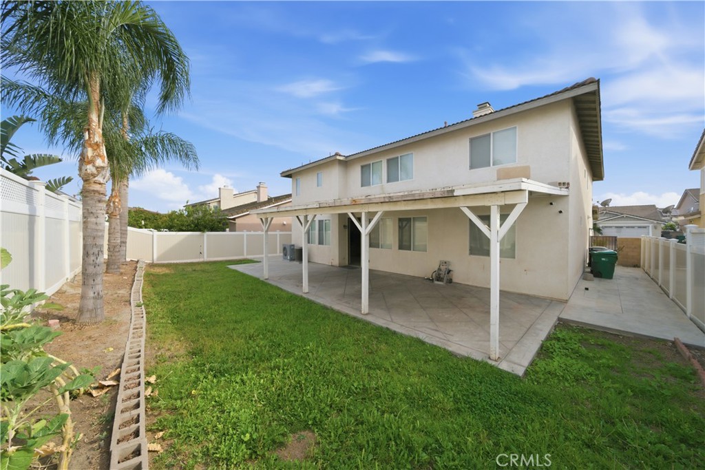 6710 Black Hawk Road Eastvale, CA 92880 - Photo 45 of 49 a view of a house with a backyard