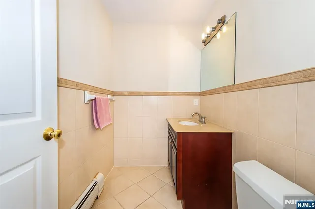 a bathroom with a shower and toilet