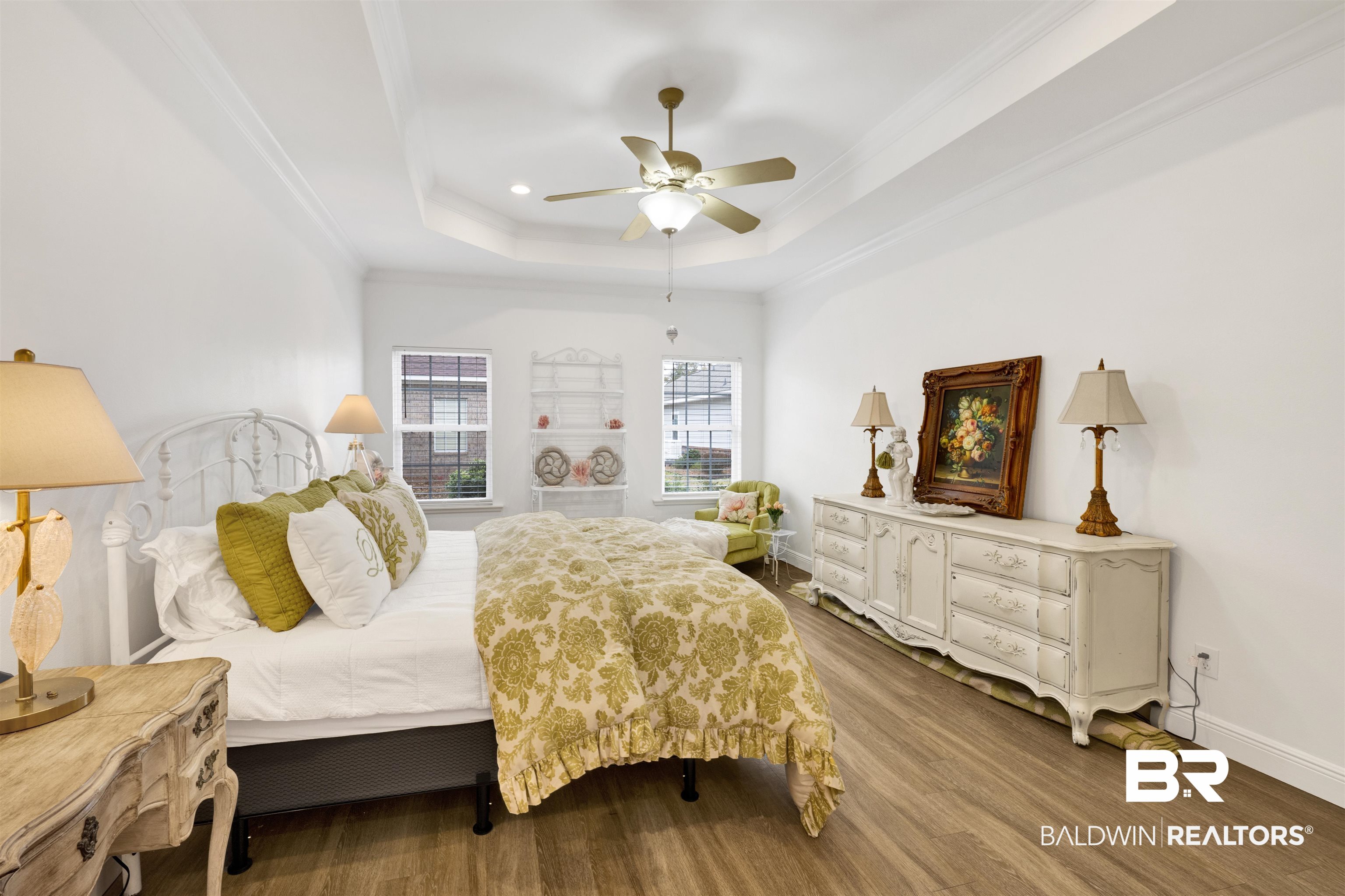 164 Mark Twain Loop Foley, AL 36535 - Photo 17 of 25 Bedroom with wood finished floors, a ceiling fan, a raised ceiling, crown molding, and recessed lighting