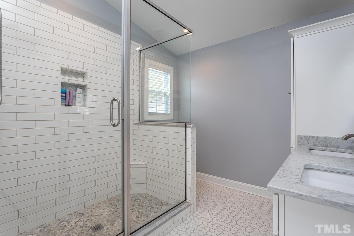 610 East Martin Street Raleigh, NC 27601 - Photo 18 of 40 a bathroom with a sink and shower