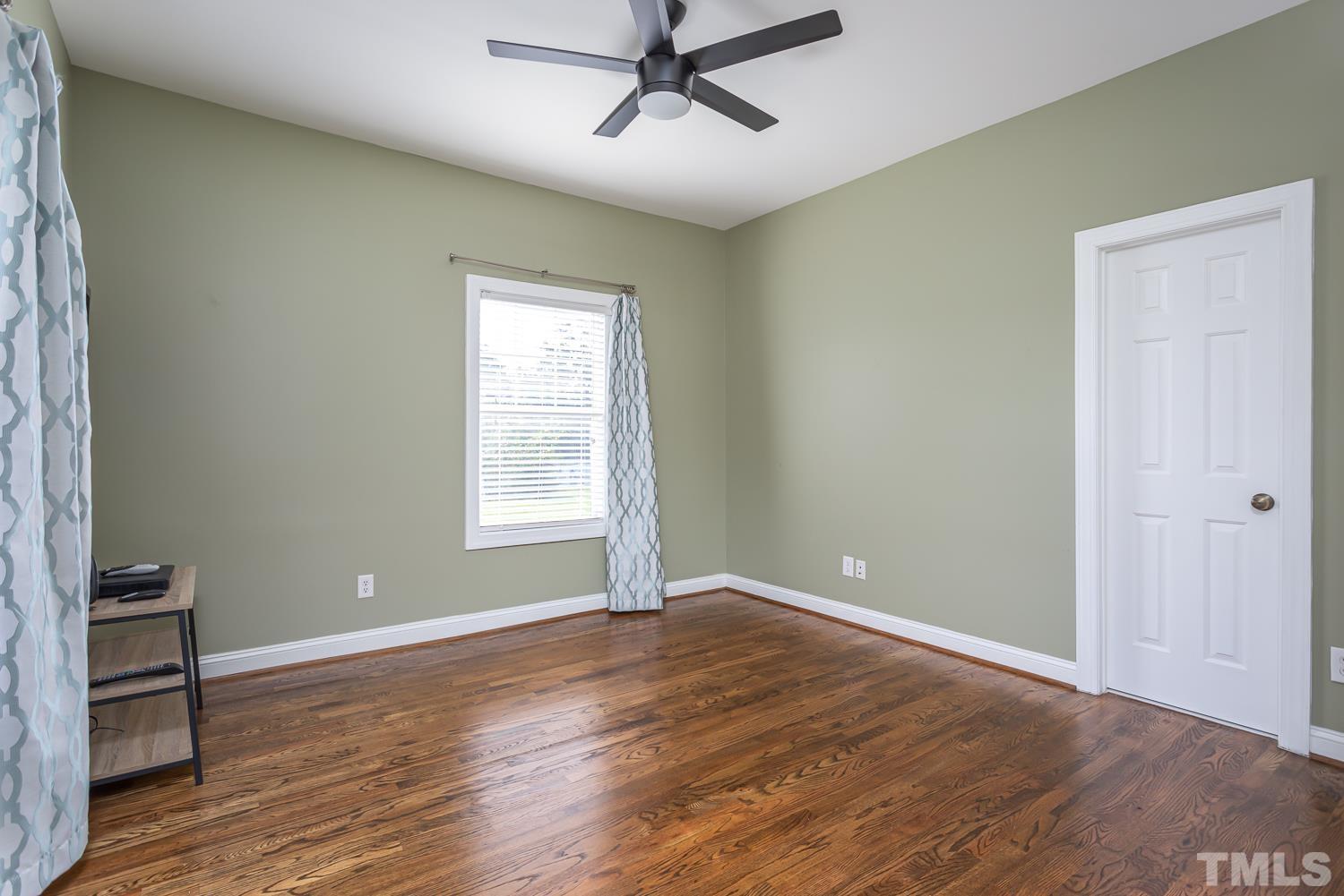 610 East Martin Street Raleigh, NC 27601 - Photo 20 of 40 a view of an empty room with wooden floor and a window
