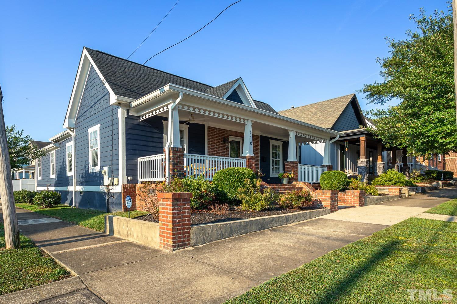 610 East Martin Street Raleigh, NC 27601 - Photo 2 of 40 a front view of a house with garden