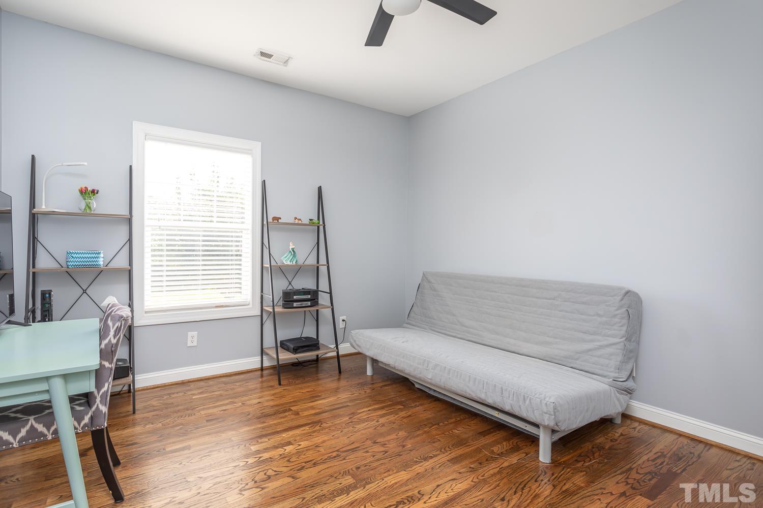 610 East Martin Street Raleigh, NC 27601 - Photo 21 of 40 a living room with furniture and a wooden floor