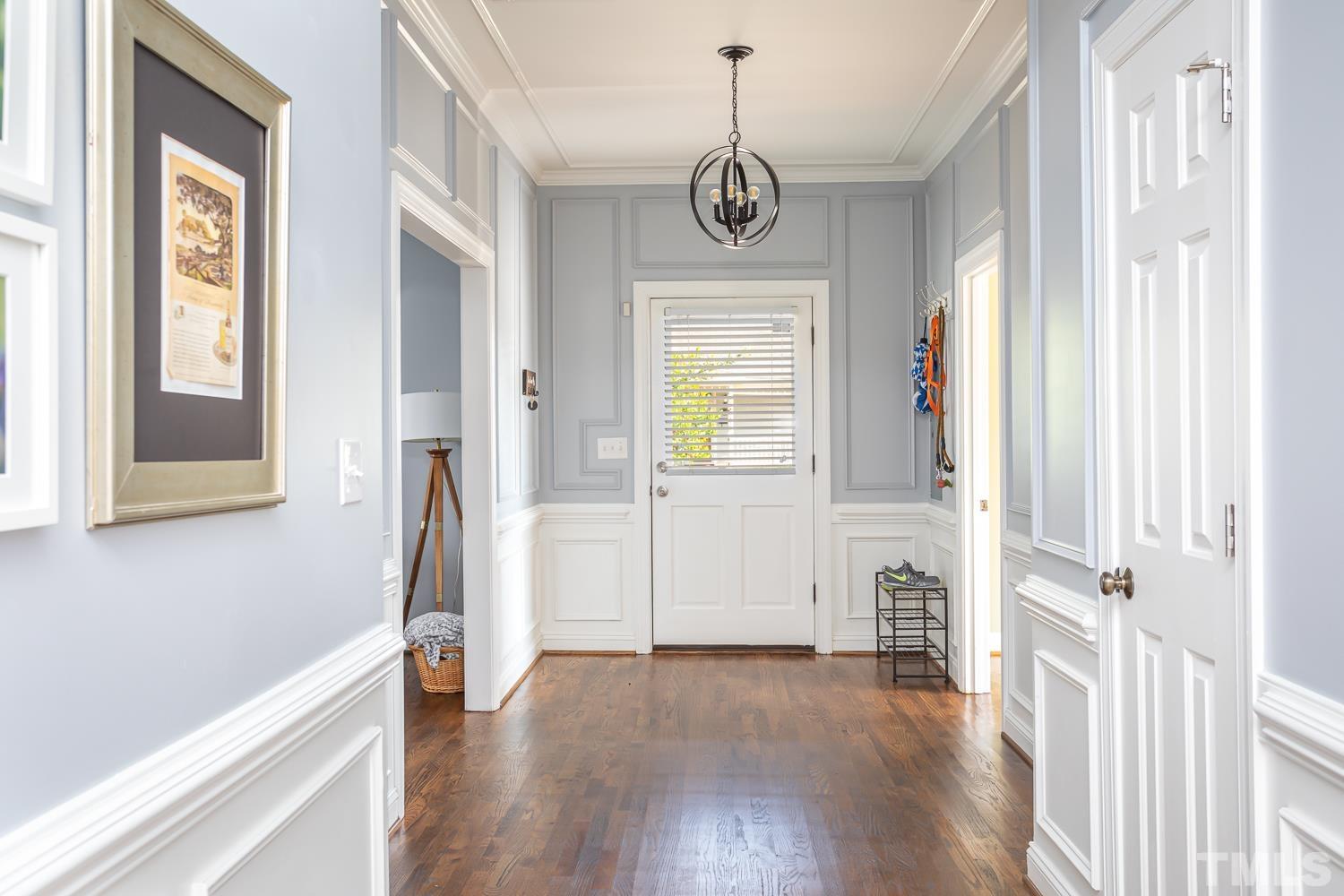 610 East Martin Street Raleigh, NC 27601 - Photo 3 of 40 a view of a hallway with wooden floor and windows
