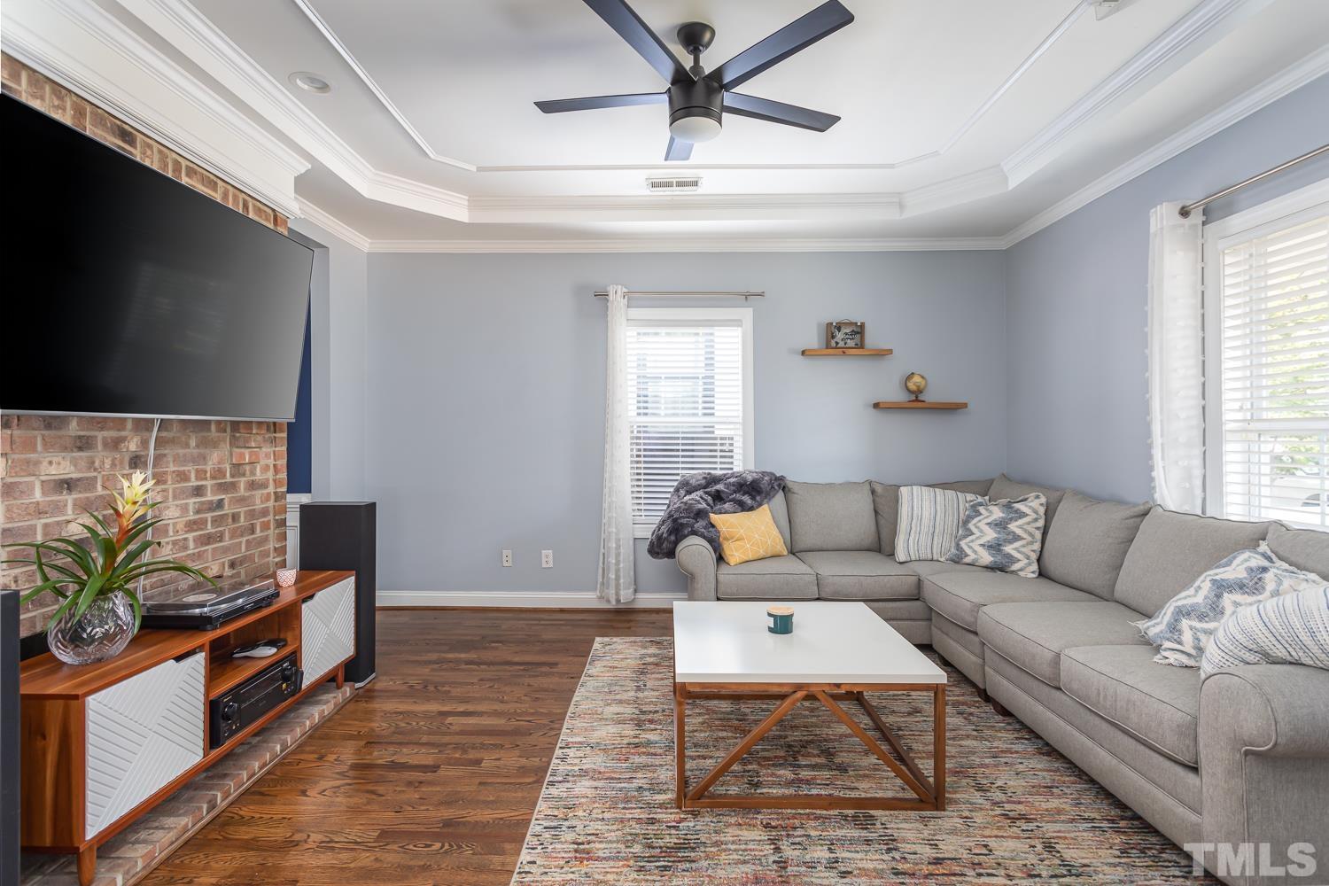 610 East Martin Street Raleigh, NC 27601 - Photo 4 of 40 a living room with furniture and a flat screen tv