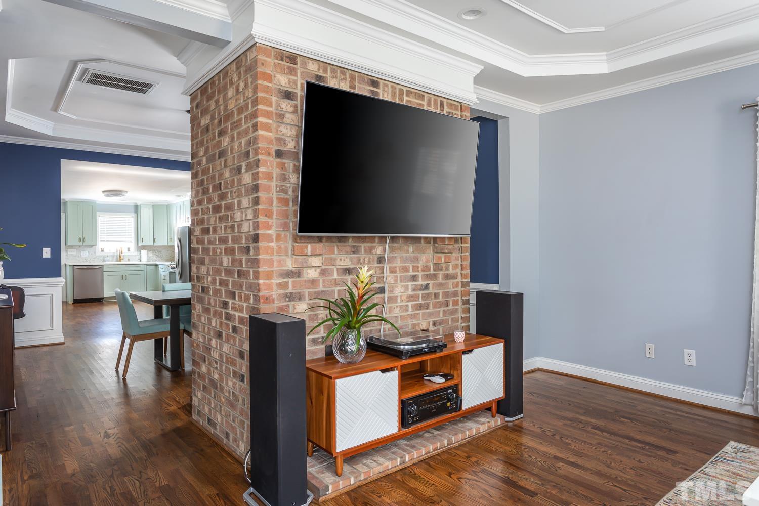 610 East Martin Street Raleigh, NC 27601 - Photo 6 of 40 a living room with furniture and a flat screen tv
