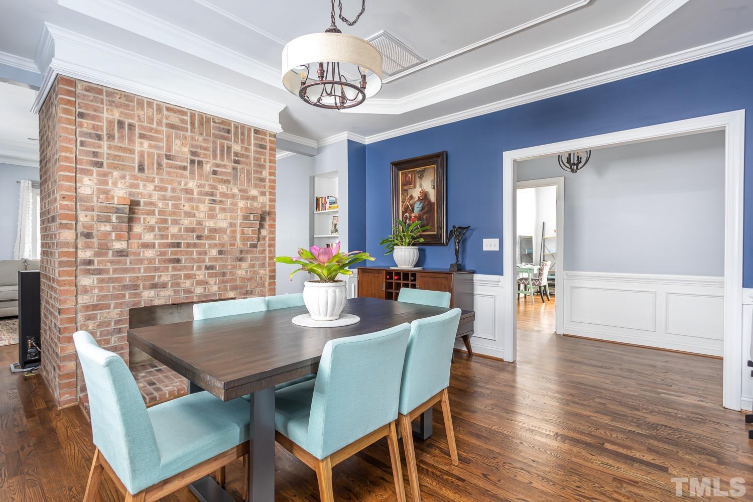 610 East Martin Street Raleigh, NC 27601 - Photo 9 of 40 a view of a dining room with furniture window and wooden floor