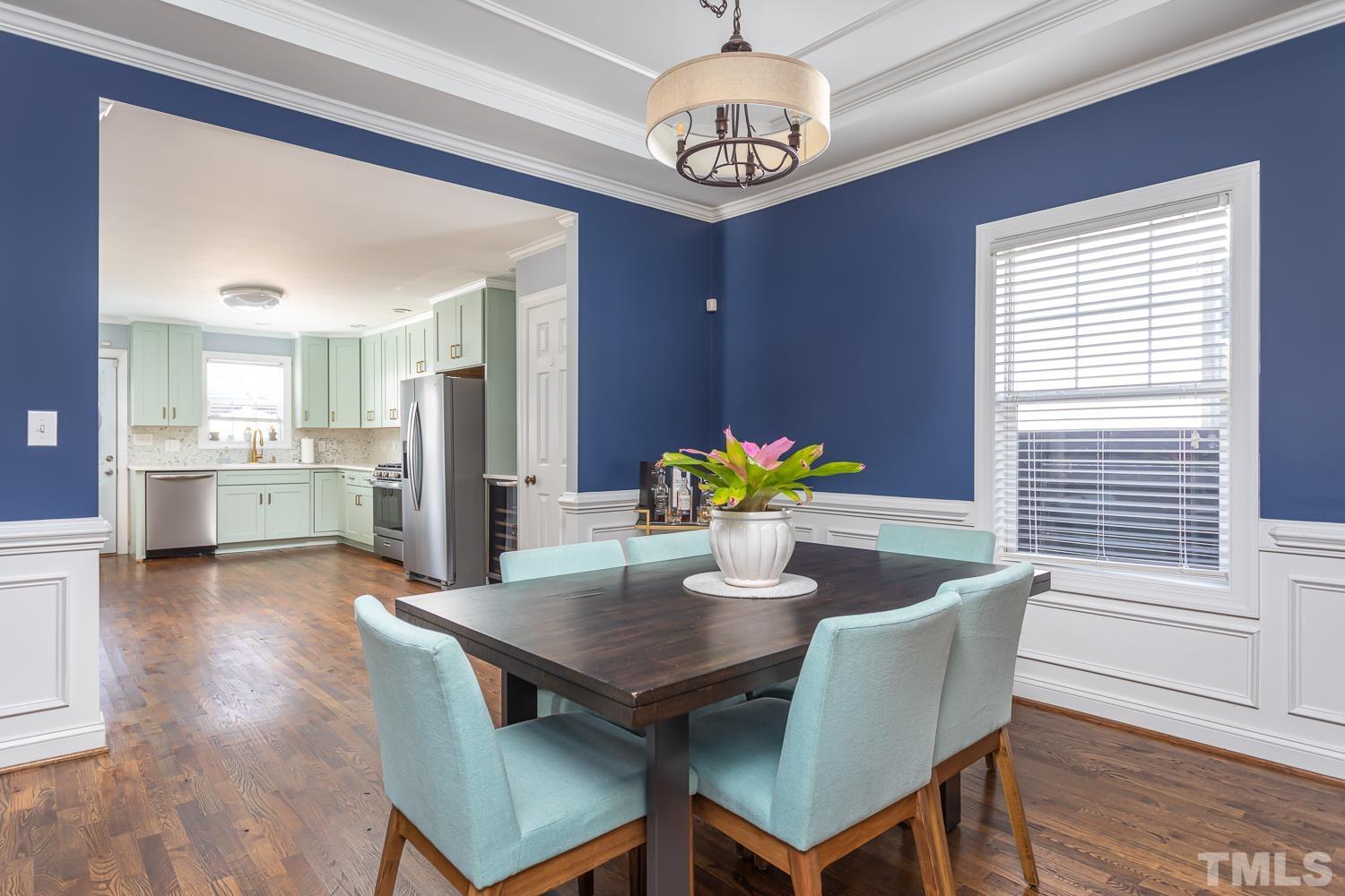 610 East Martin Street Raleigh, NC 27601 - Photo 10 of 40 a view of a dining room with furniture and chandelier