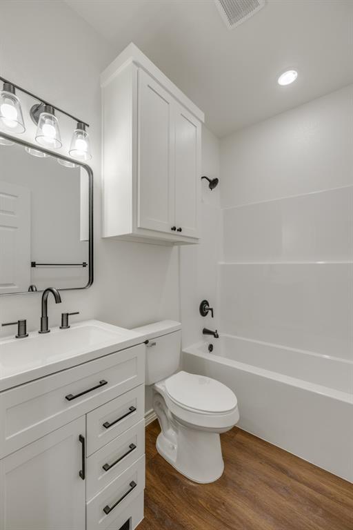 900 Ruger Drive Clyde, TX 79510 - Photo 10 of 11 a bathroom with a toilet sink a mirror and vanity