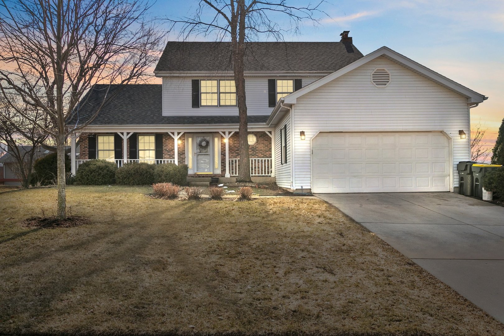 323 Bryan Drive Cary, IL 60013 - Photo 1 of 21 a front view of a house with a yard and garage