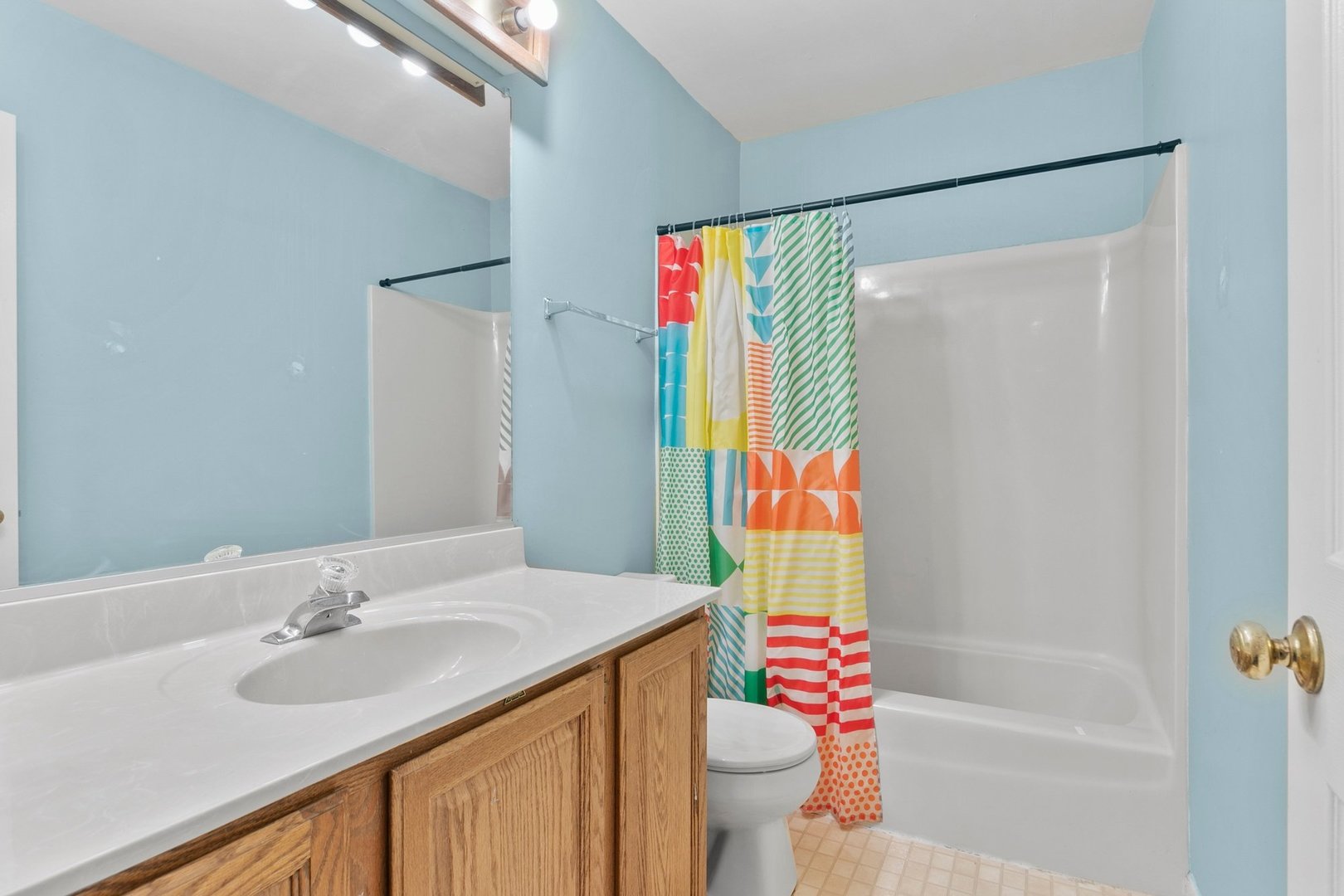 323 Bryan Drive Cary, IL 60013 - Photo 13 of 21 a bathroom with a sink and a mirror