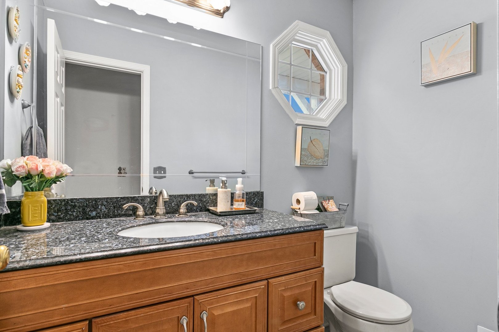 323 Bryan Drive Cary, IL 60013 - Photo 14 of 21 a bathroom with a toilet sink and mirror
