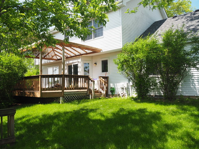 323 Bryan Drive Cary, IL 60013 - Photo 20 of 21 a view of a house with a yard and a large tree