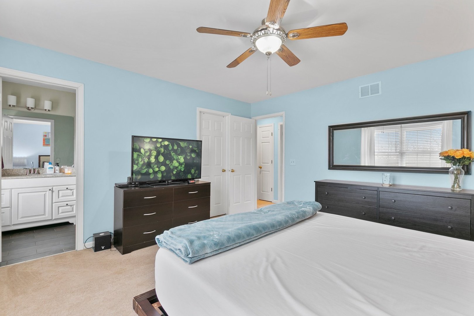 323 Bryan Drive Cary, IL 60013 - Photo 8 of 21 a bedroom with a bed and a dresser
