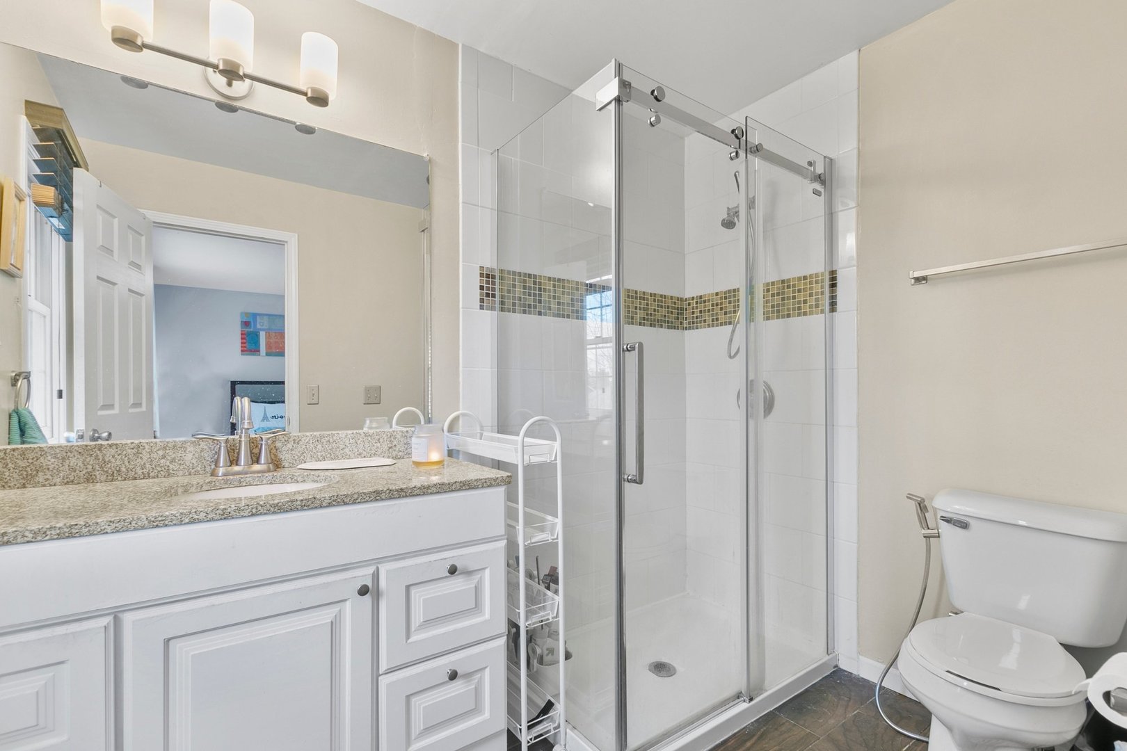 323 Bryan Drive Cary, IL 60013 - Photo 9 of 21 a bathroom with a shower sink vanity mirror and toilet