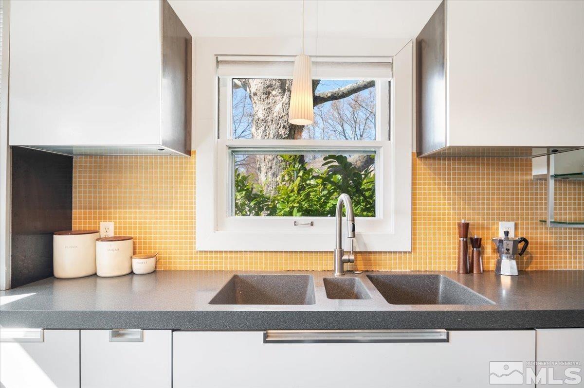 1250 Watt Street Reno, NV 89509 - Photo 11 of 33 a kitchen with a sink and a large window