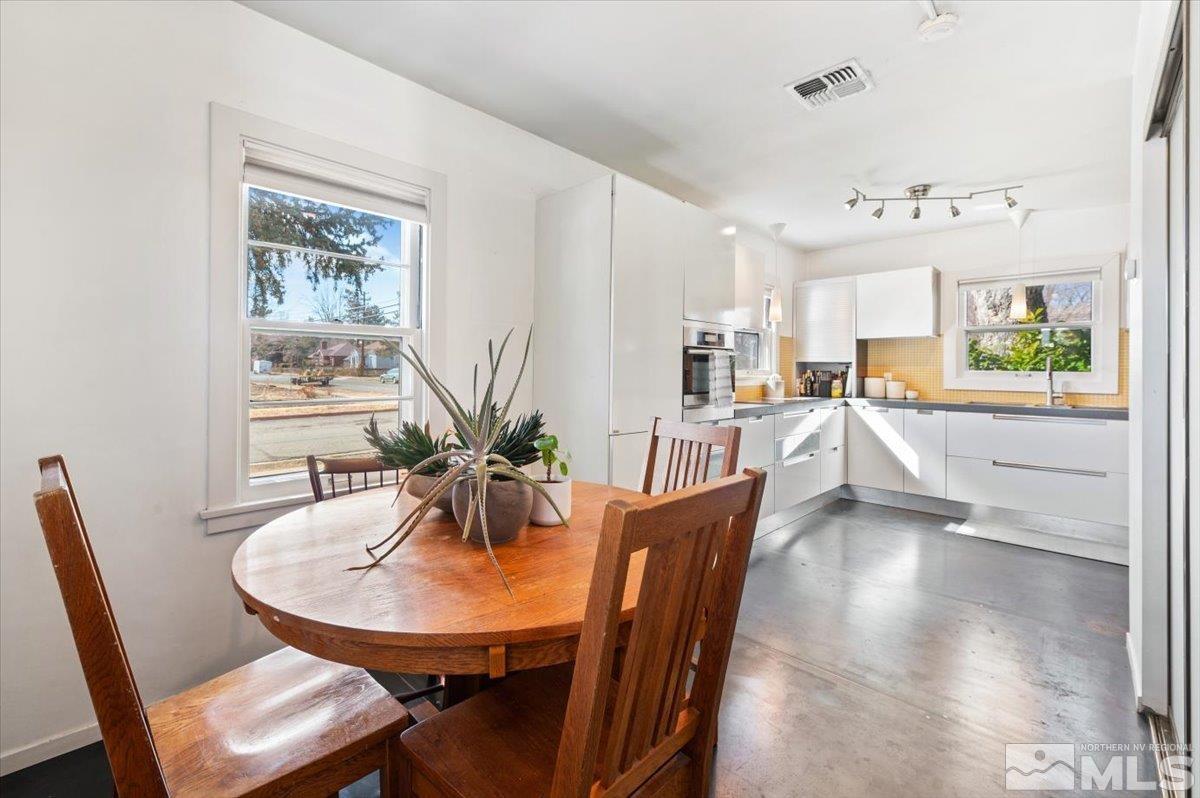1250 Watt Street Reno, NV 89509 - Photo 14 of 33 a view of a dining room with furniture window and wooden floor