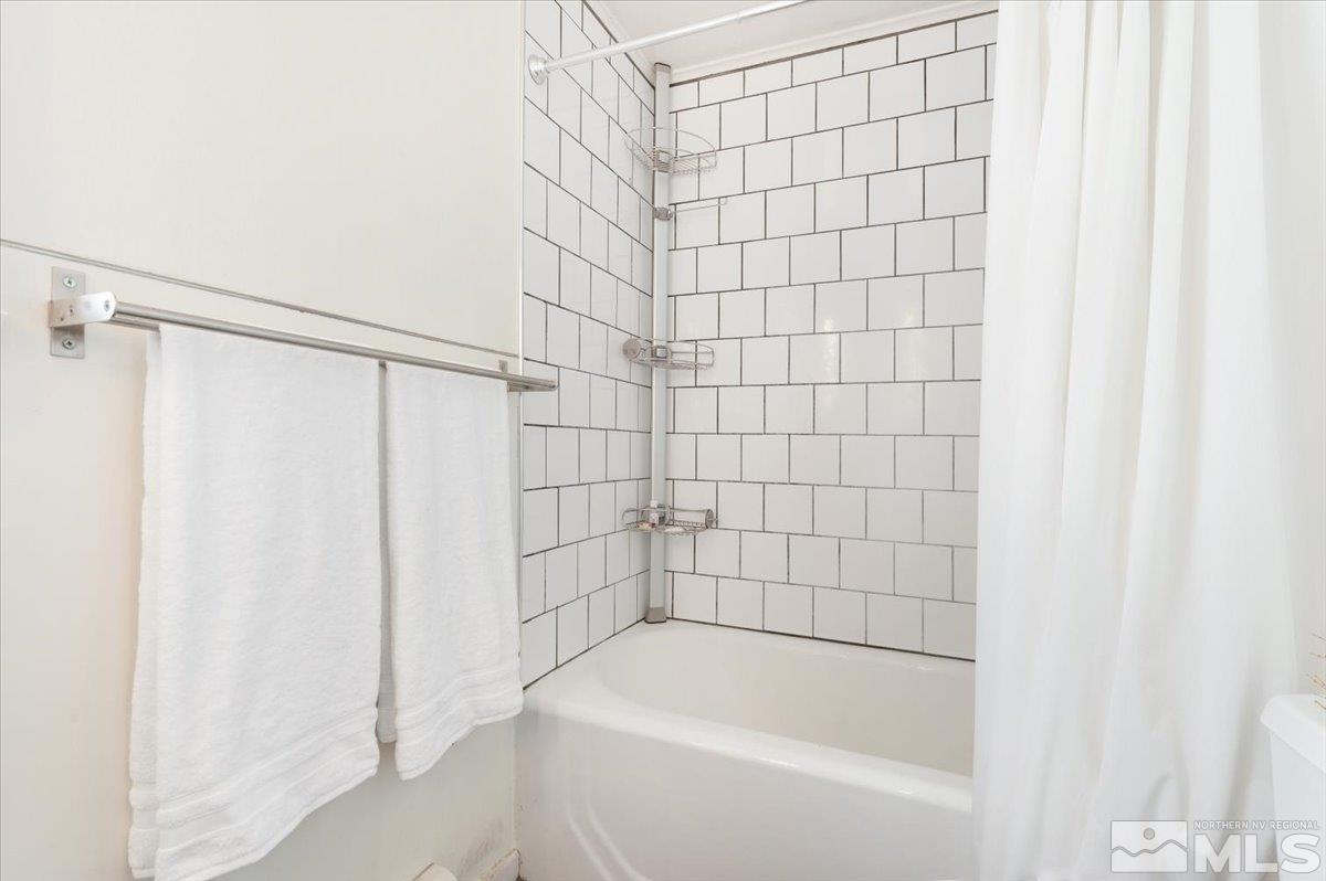 1250 Watt Street Reno, NV 89509 - Photo 17 of 33 a bathroom with a shower and a bathtub