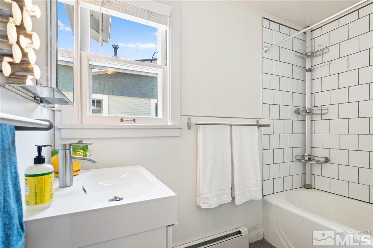 1250 Watt Street Reno, NV 89509 - Photo 18 of 33 a bathroom with a bathtub and a shower