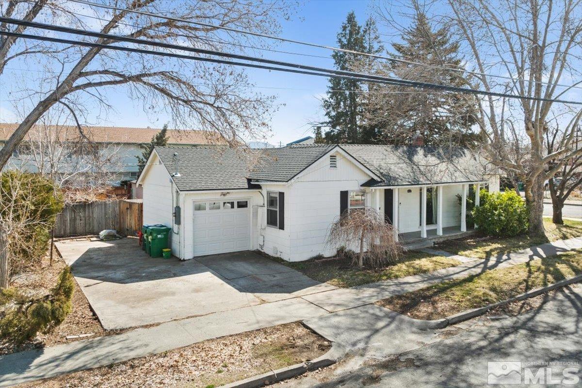 1250 Watt Street Reno, NV 89509 - Photo 2 of 33 a view of a white house with a yard covered in snow