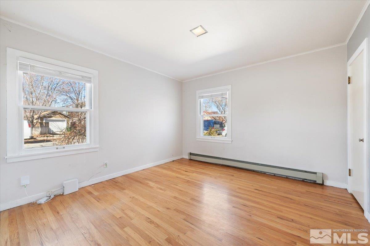 1250 Watt Street Reno, NV 89509 - Photo 21 of 33 wooden floor in an empty room with a window