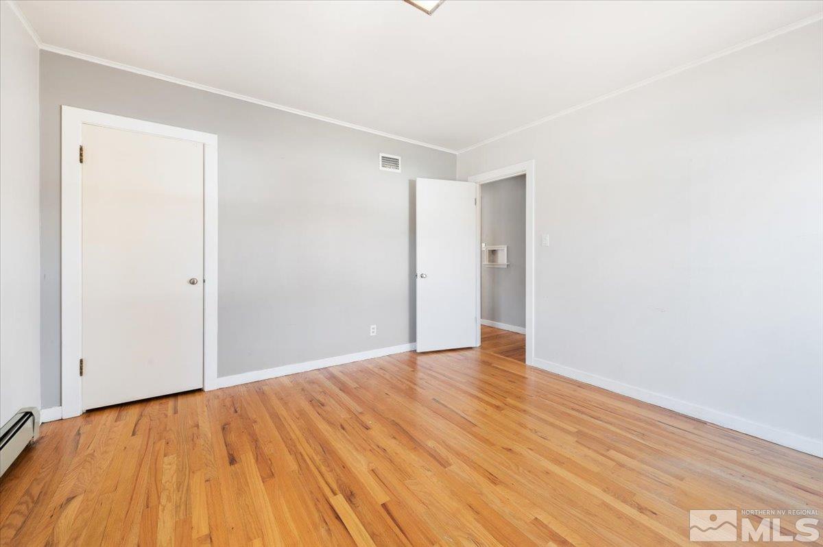 1250 Watt Street Reno, NV 89509 - Photo 22 of 33 a view of an empty room with wooden floor