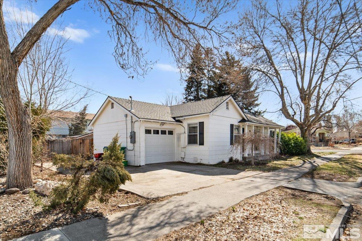 1250 Watt Street Reno, NV 89509 - Photo 4 of 33 a white house with a large tree in front of it
