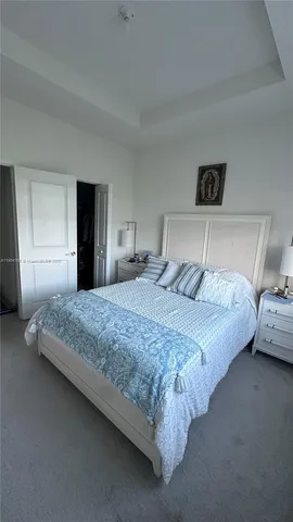 a bedroom with bed and window
