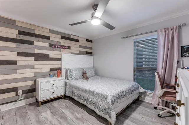 a bedroom with a bed and a tv in it