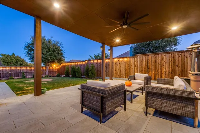 a backyard view with a sitting space