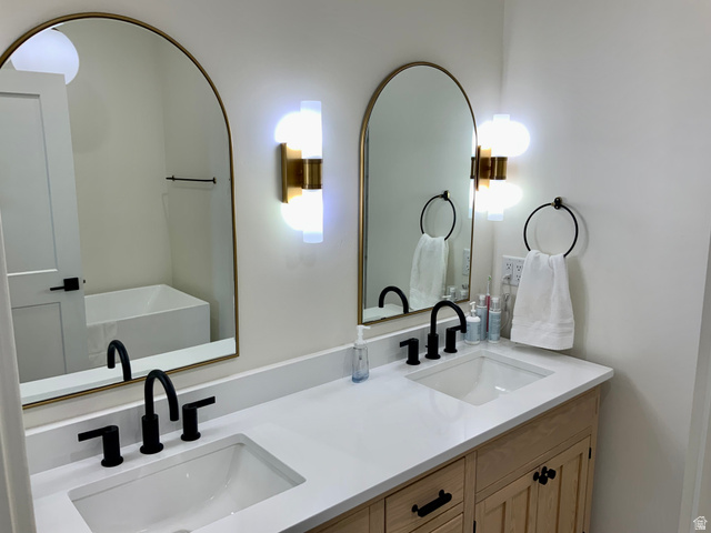 277 West 800 South Monroe, UT 84754 - Photo 16 of 46 Full bathroom with double vanity and a soaking tub