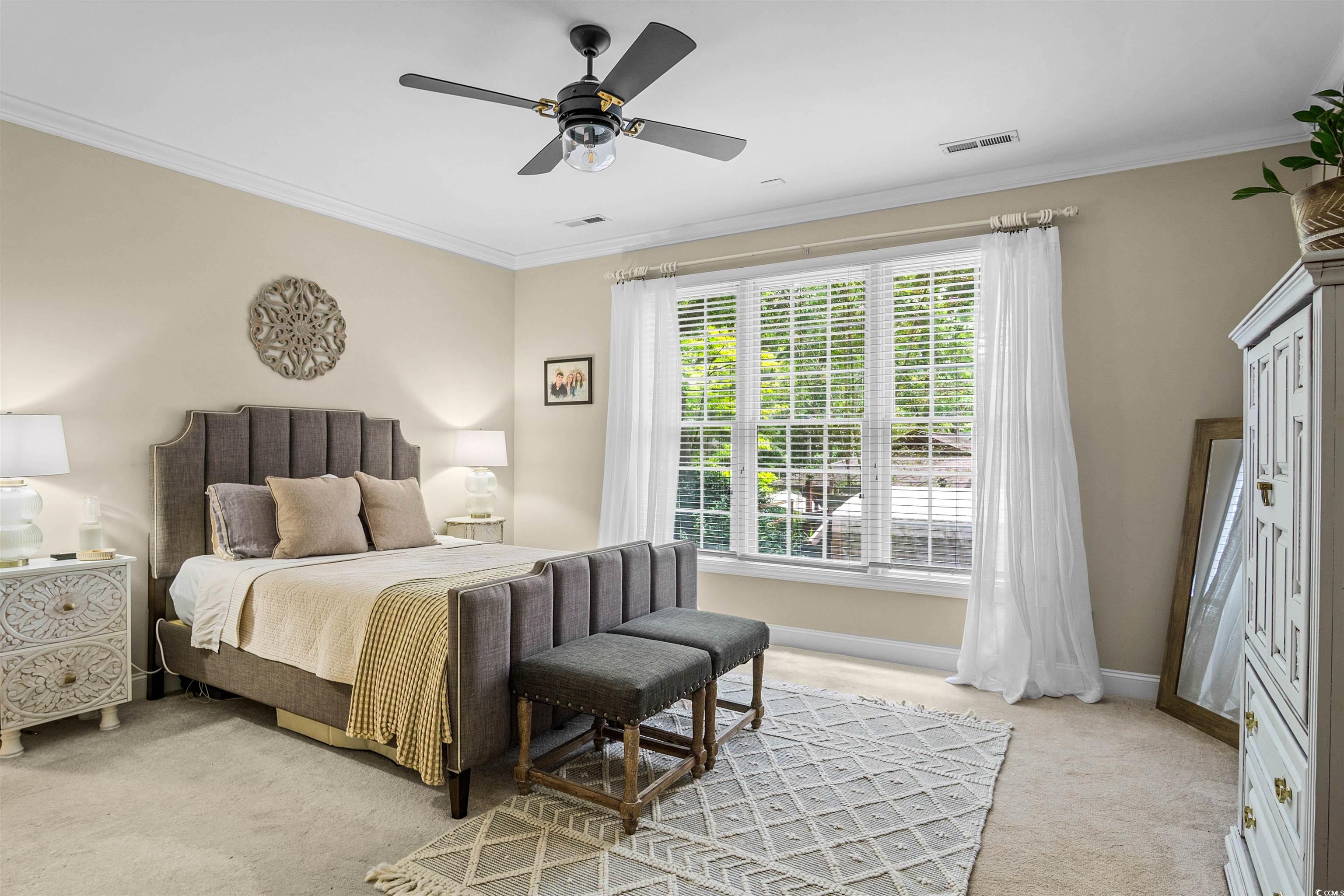 1079 Waterway Lane Myrtle Beach, SC 29572 - Photo 16 of 38 Carpeted bedroom featuring crown molding and a ceiling fan