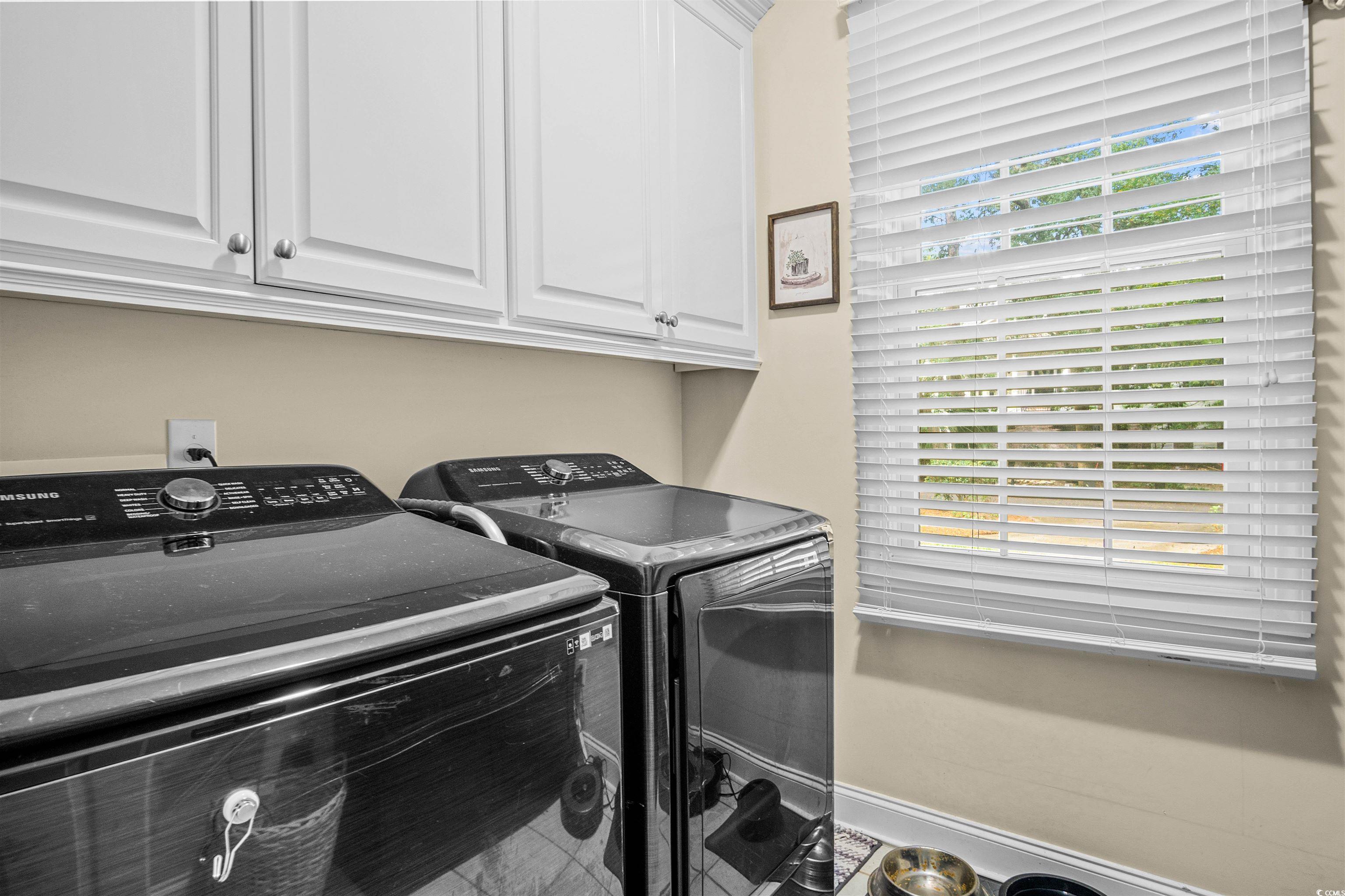 1079 Waterway Lane Myrtle Beach, SC 29572 - Photo 20 of 38 Bathroom featuring ornamental molding, double vanity, a bath, and light tile patterned floors