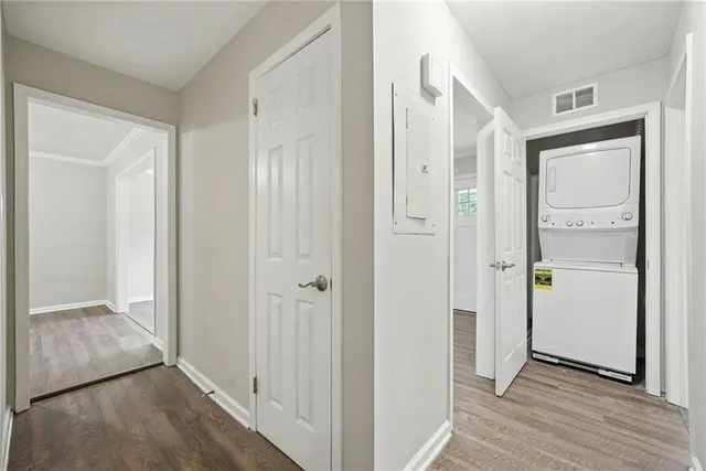 a view of hallway with wooden floor