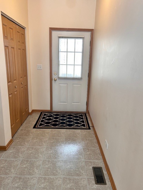 623 Waterview Court Naperville, IL 60563 - Photo 3 of 22 a white cabinet sitting in a kitchen next to a window