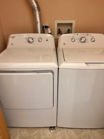 a utility room with dryer and washer