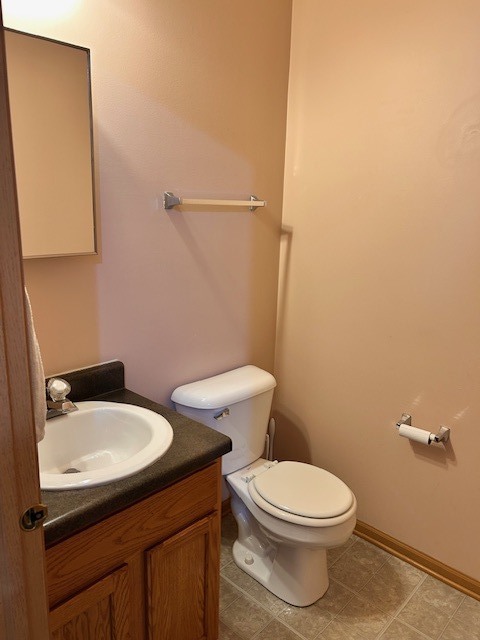 623 Waterview Court Naperville, IL 60563 - Photo 10 of 22 a white toilet sitting next to a bathroom sink