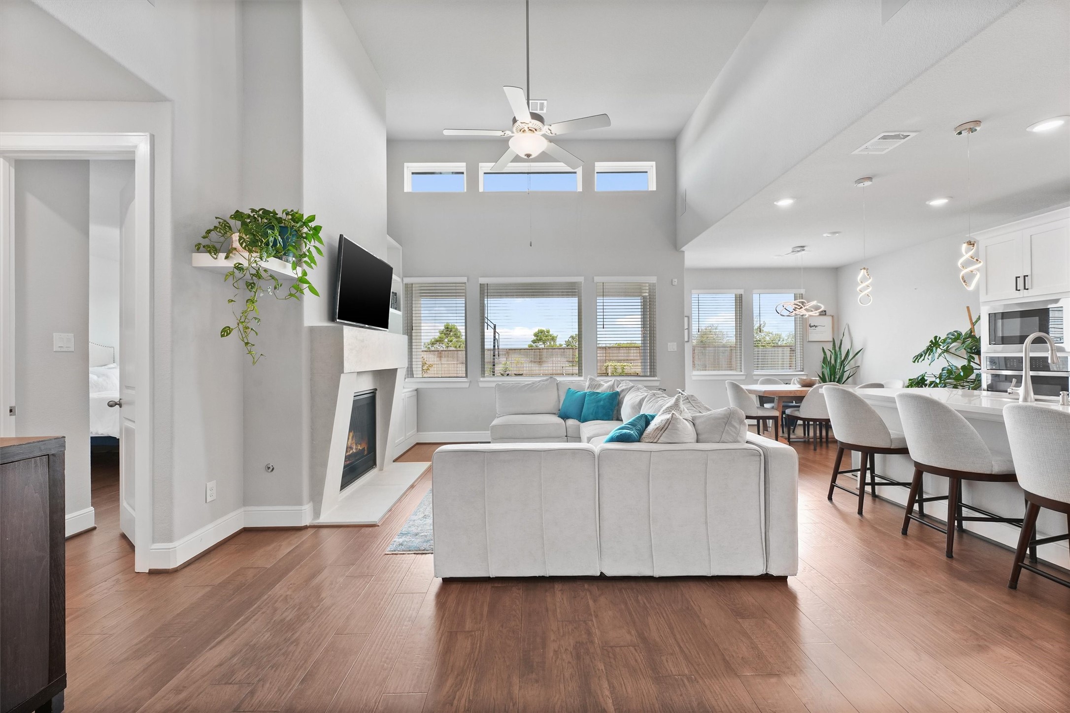 a living room with fireplace furniture and a wooden floor
