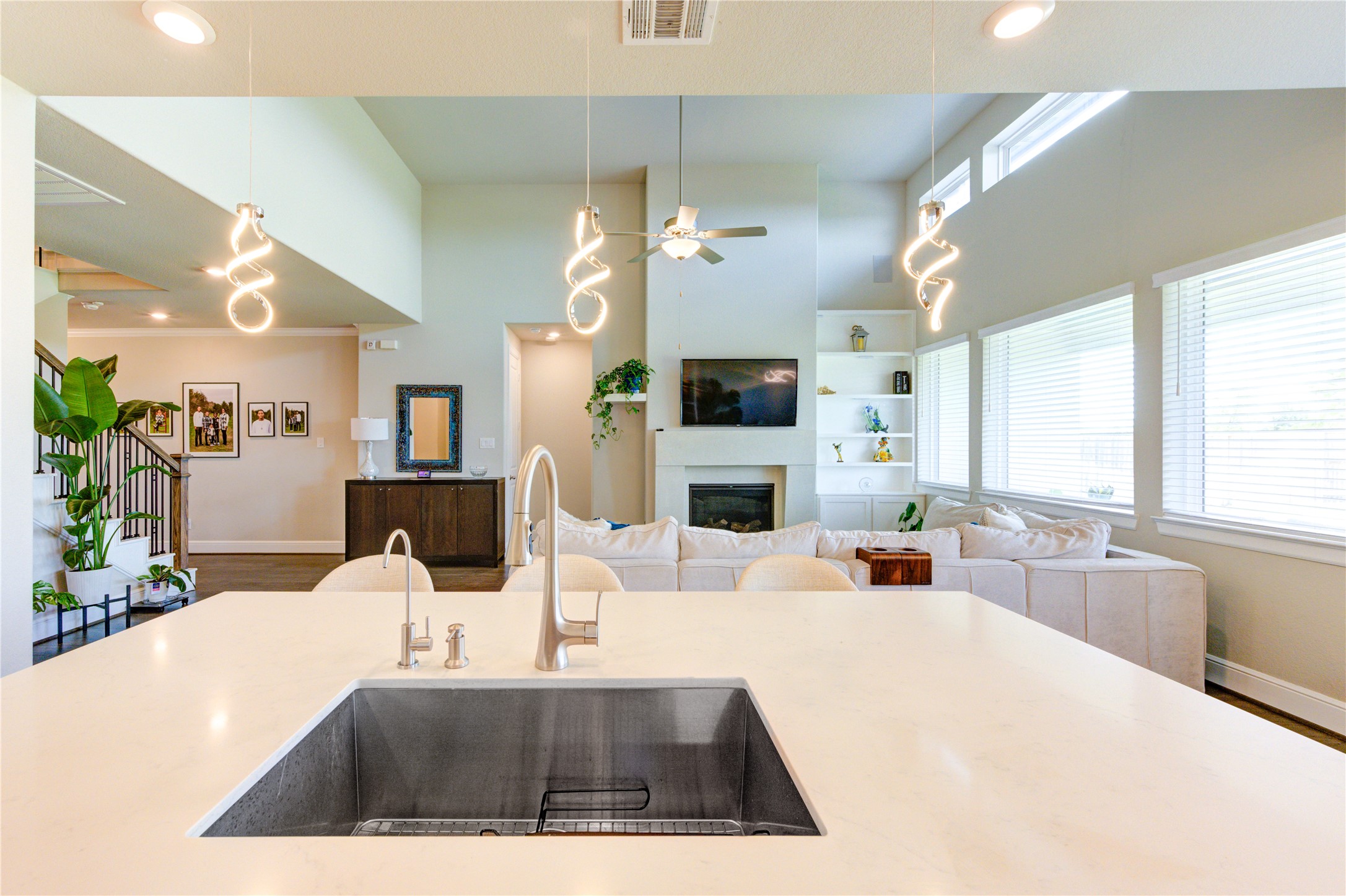 4050 Shackleton Court Iowa Colony, TX 77583 - Photo 13 of 48 a view of a kitchen with kitchen island a window a sink and a living room view