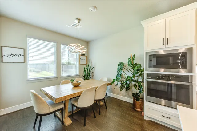a dining room with furniture and window