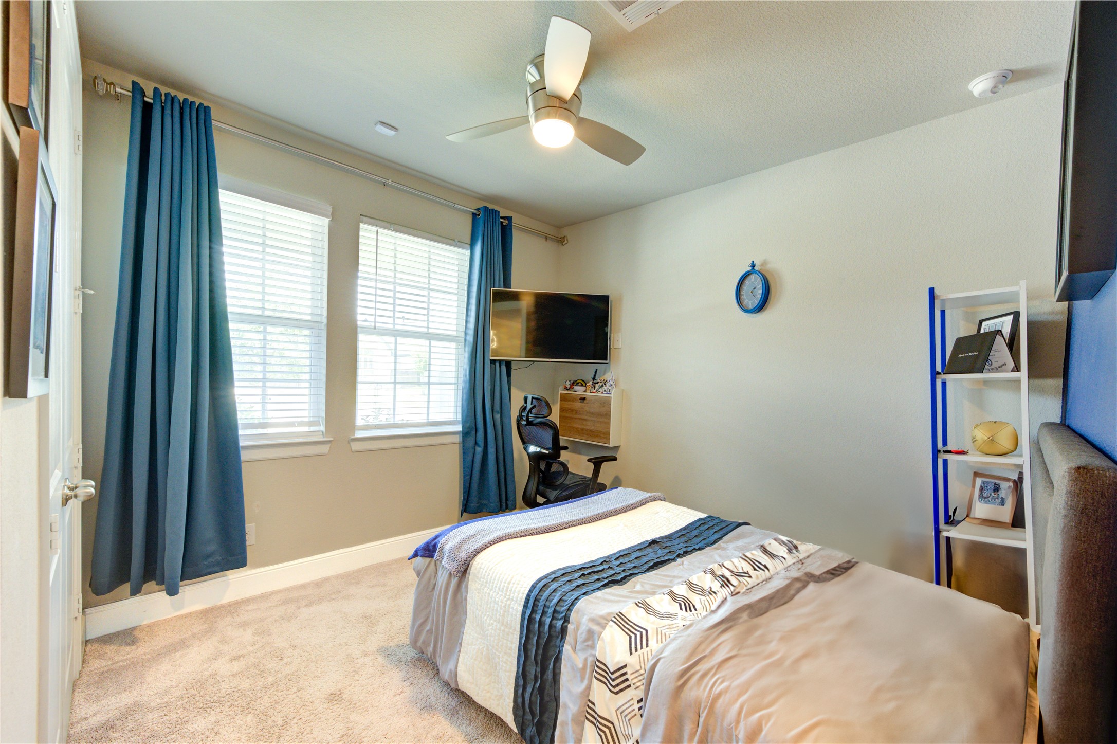 4050 Shackleton Court Iowa Colony, TX 77583 - Photo 32 of 48 a bedroom with a bed and a flat screen tv