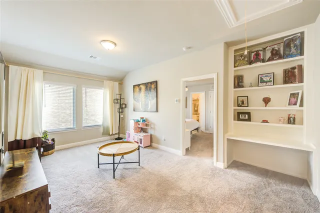 a living room with furniture a rug and a large window