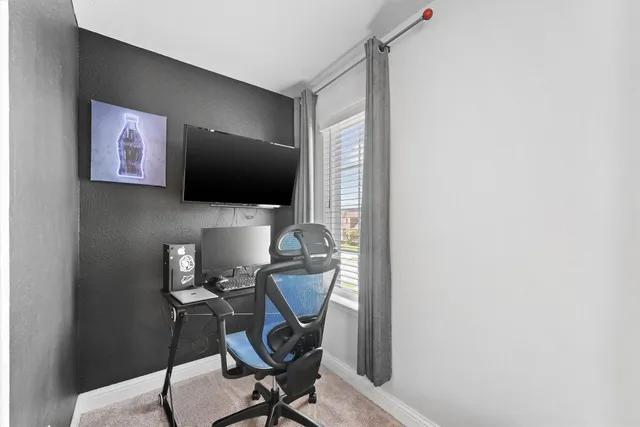 a living room with a bed furniture and a window