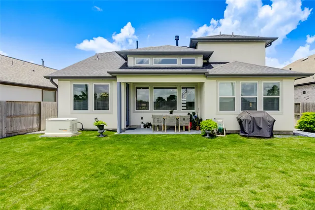 a view of a house with a big yard