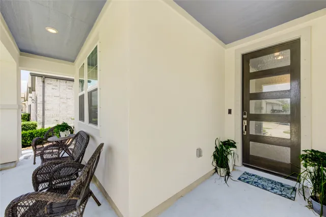a room with furniture and a potted plant