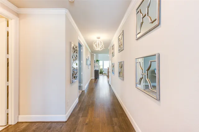 a view of a hallway view with wooden floor and staircase