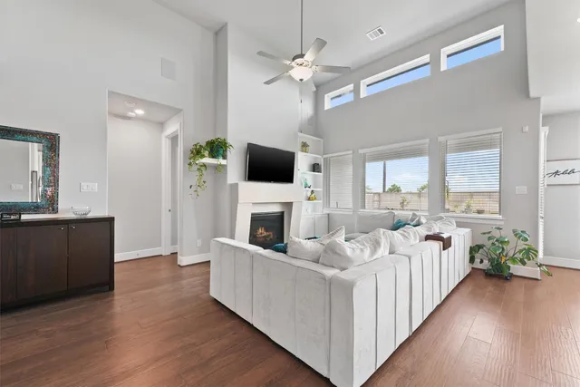 a living room with furniture fireplace and flat screen tv