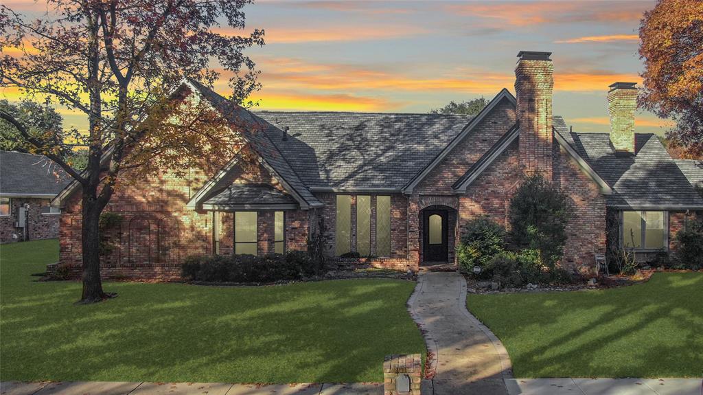 Breathtaking curb appeal with antique brick style and upgraded roof. 