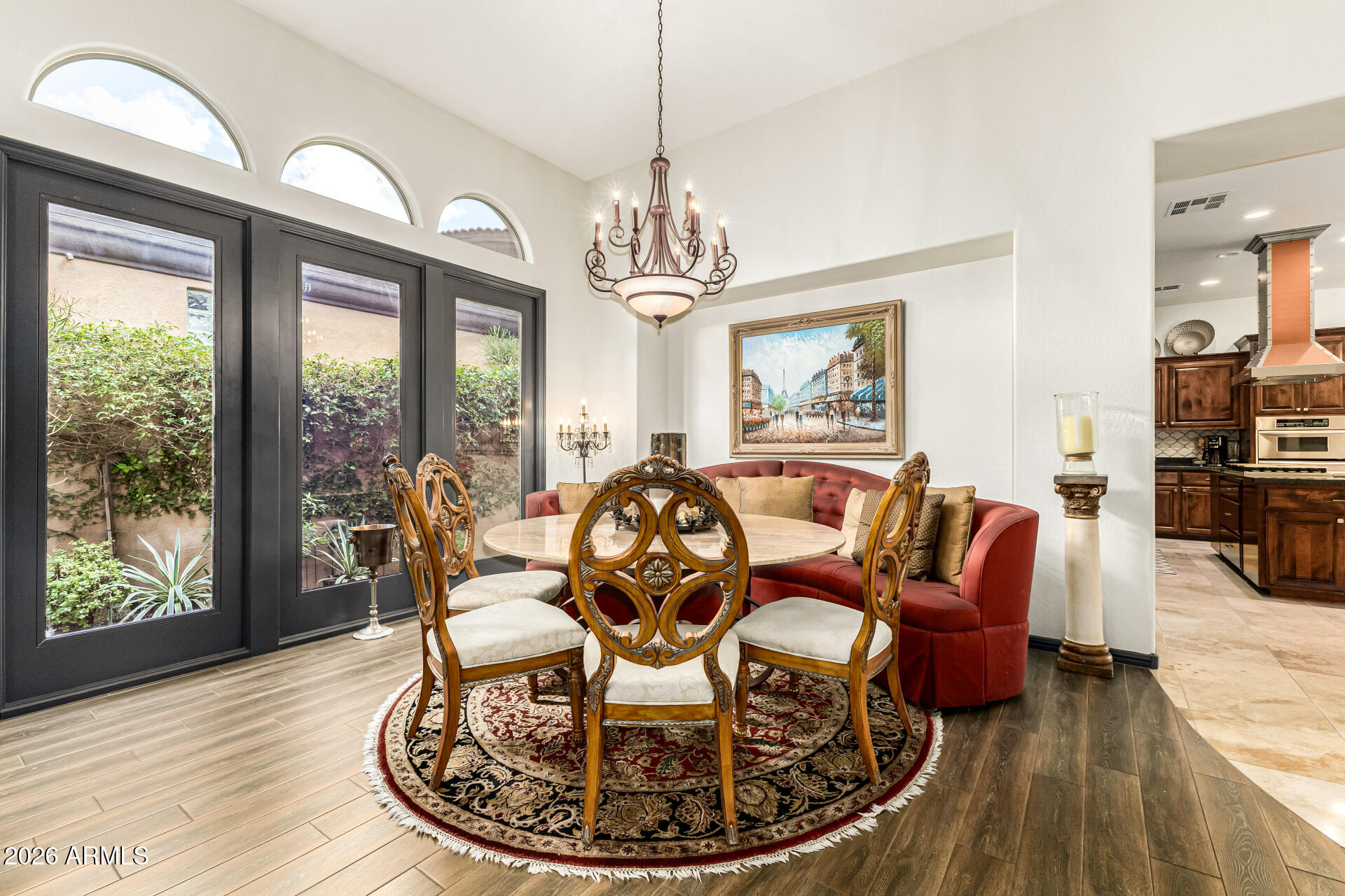 3418 East Pyrenees Pass Phoenix, AZ 85018 - Photo 12 of 46 a living room with furniture chandelier and a large window