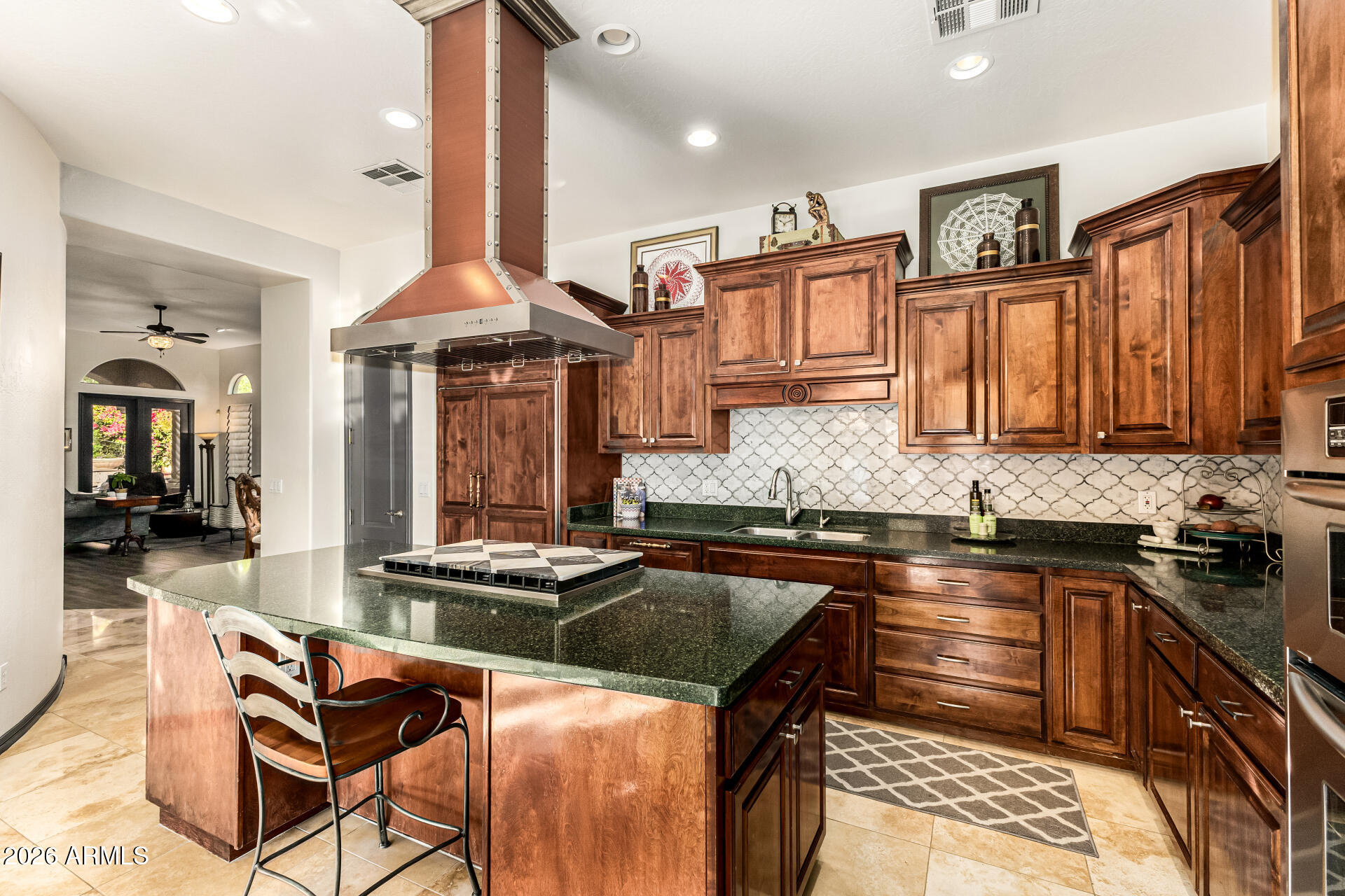 3418 East Pyrenees Pass Phoenix, AZ 85018 - Photo 14 of 46 a kitchen with granite countertop a sink stove and cabinets